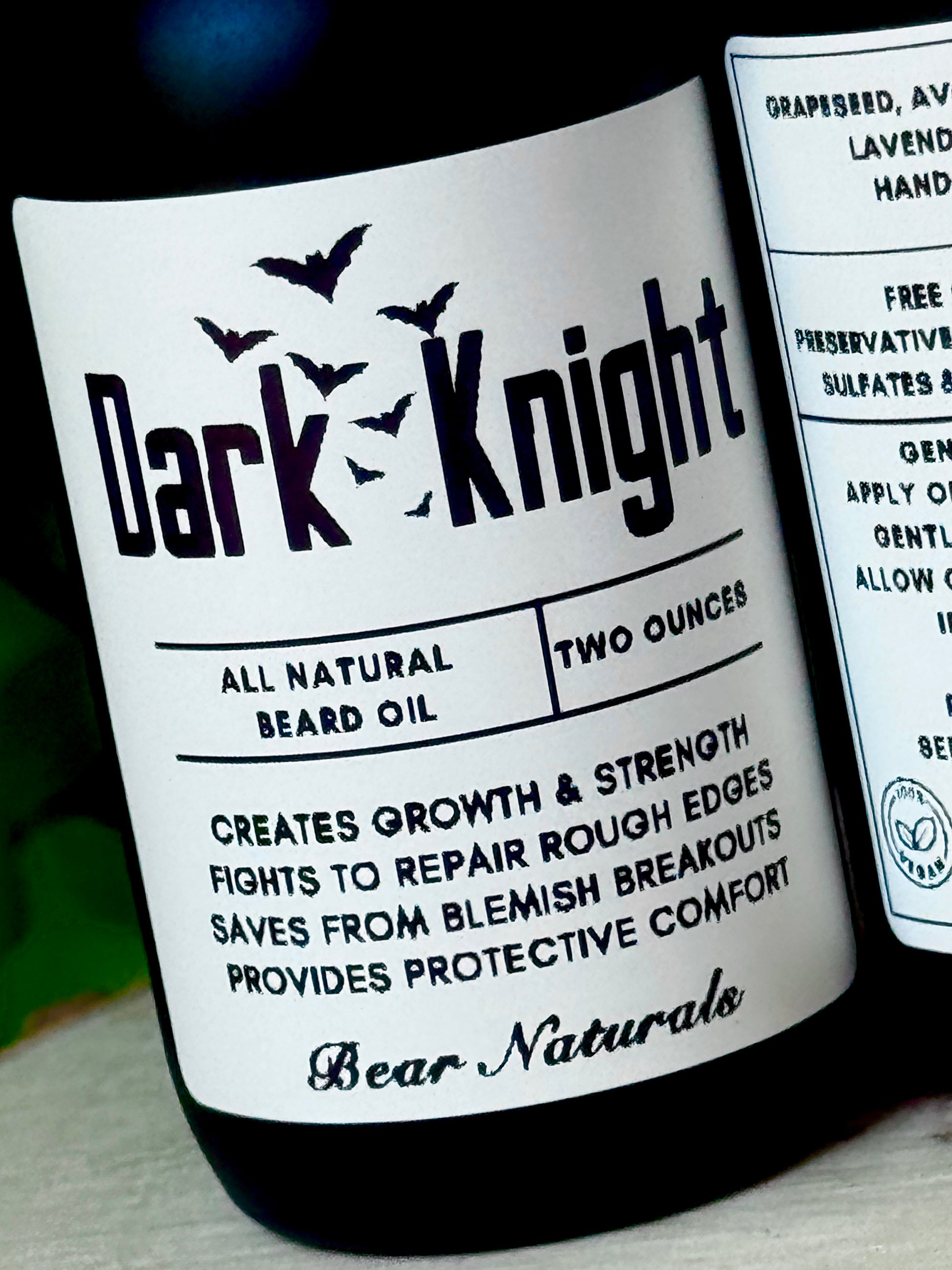Close up of the front label for the 'Dark Knight' all natural beard oil.